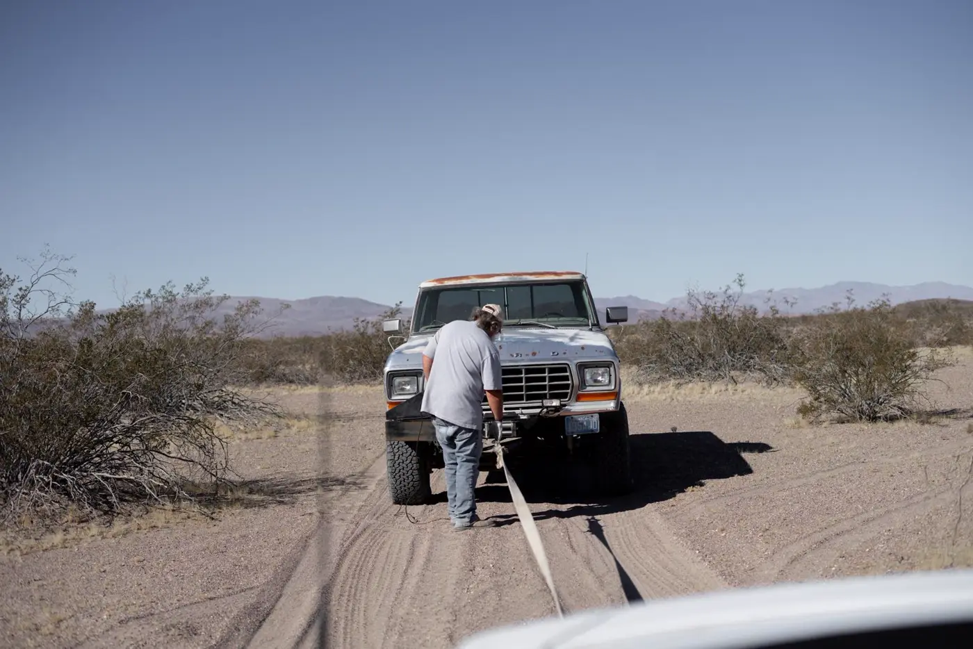 A recovery strap hooked to a stuck pickup truck (representative photo)